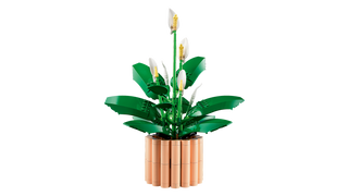 Realistic green LEGO plant with a beige pot featuring spathiphyllum leaves and white flowers.